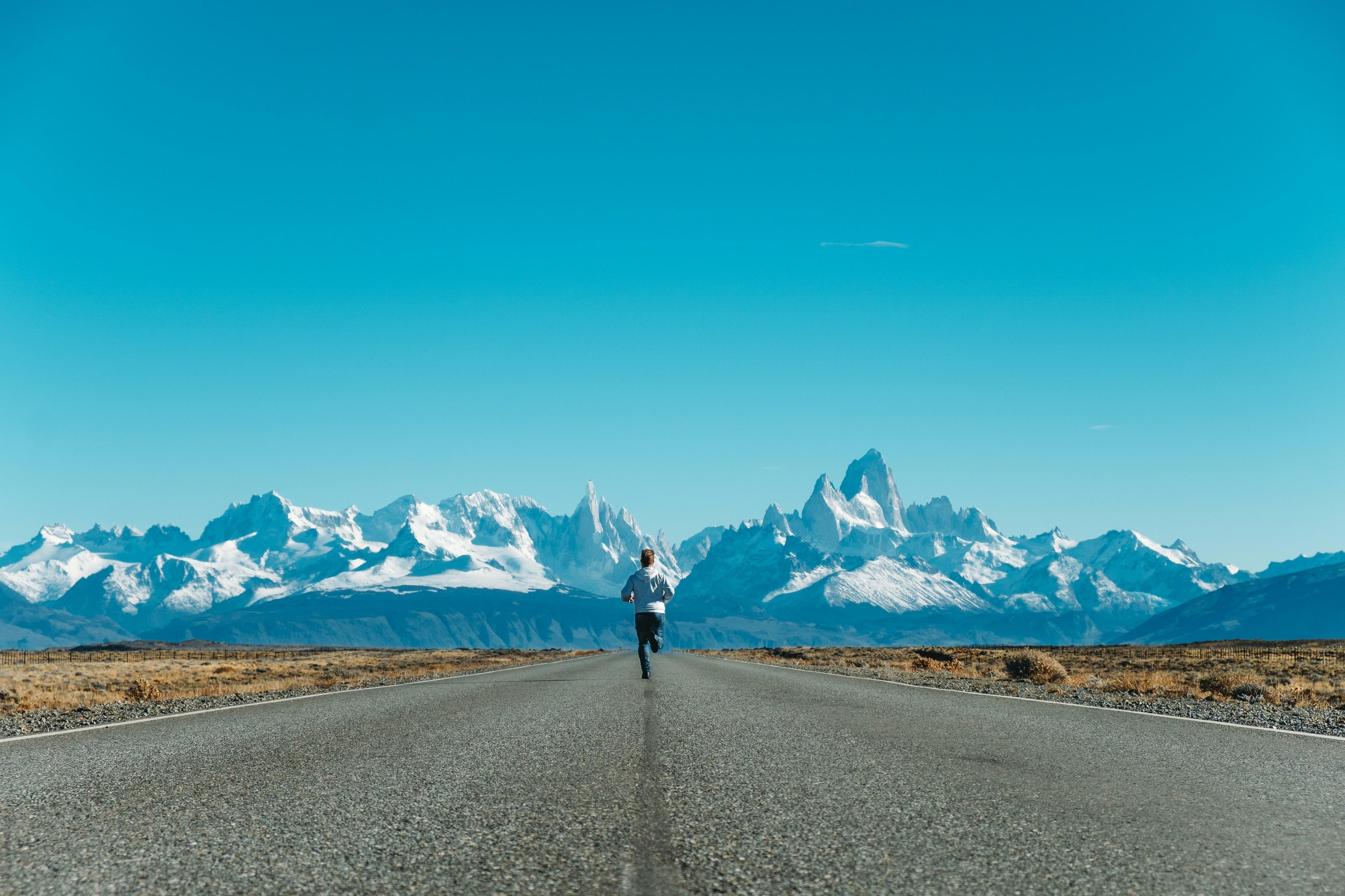 Runners with a mountain backdrop
